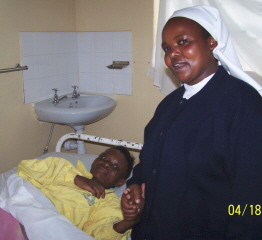 Sr. Lucy comforting a patient dying of AIDS